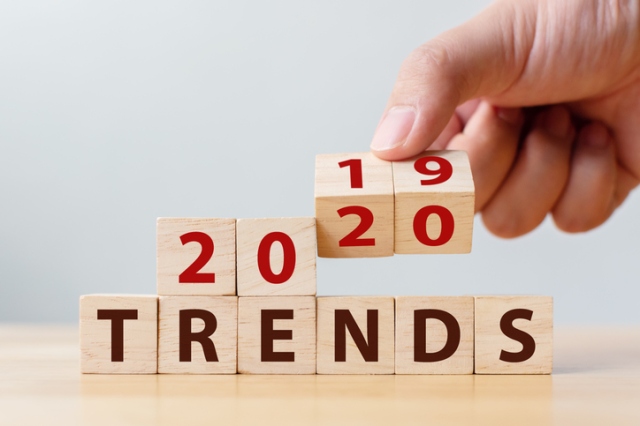 2020 trend concept. Hand flip wood cube change year 2019 to 2020